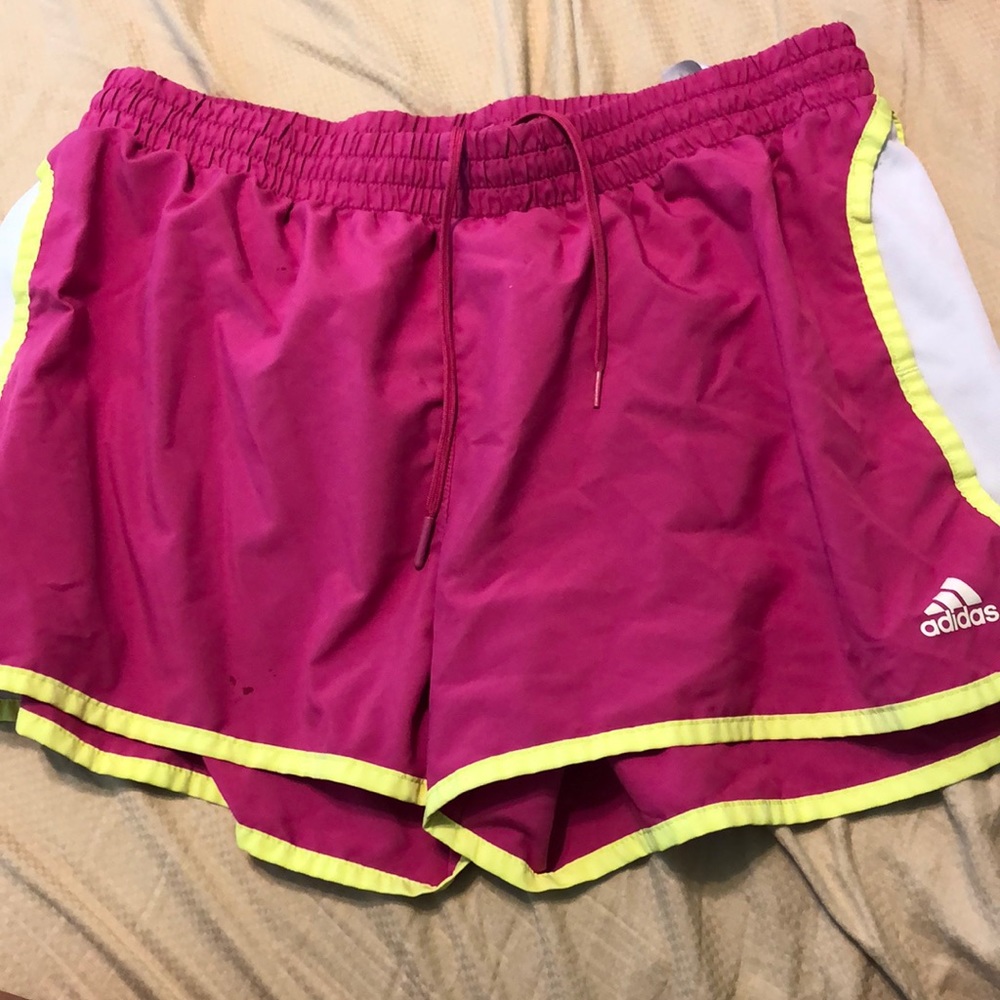 Pink and yellow Adidas running shorts